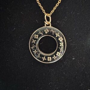 LV Gold toned Circle Pendant